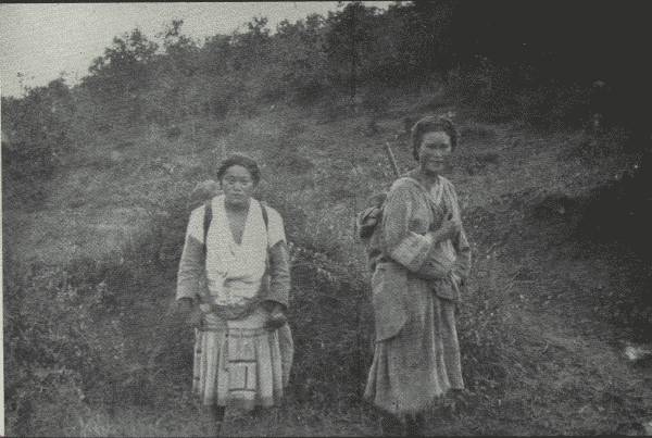 TWO VERY PRACTICAL WOMEN

Though their tribes have lived on same range of mountains "for eighty
centuries," they speak different languages and lead different life
generally. (One carries baby.)
