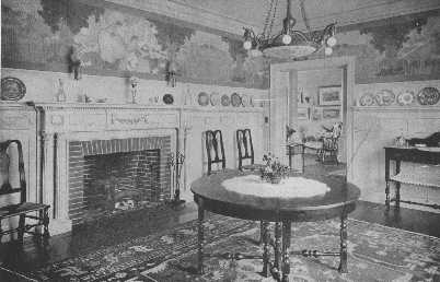 There are few treatments for walls in a Colonial
dining-room that can compare with paneled walls, or wainscoting with a
decorative paper above. The subject, however, must be in keeping. This
paper is extremely inappropriate, and the center light is also badly
chosen and could be eliminated.
