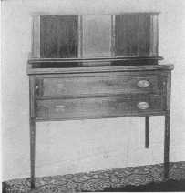One of Sheraton's charming desks, with sliding doors made
of thin strips of wood glued on cloth.
