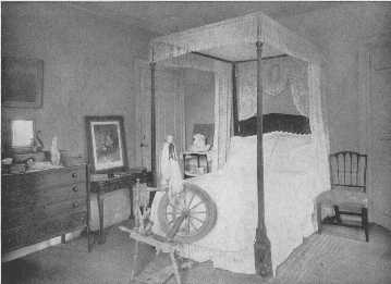 This room is unattractive because of the poor arrangement
of the furniture and the inappropriate bed-hangings. The bed, Sheraton
chair, and card-table, are all very good examples.