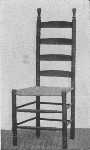 This simple slat-backed chair can be made most attractive
at small expense with paint and a motif from the chintz for decoration.