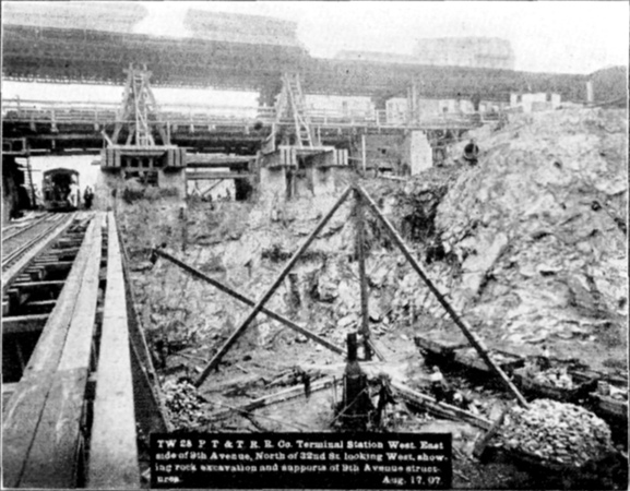 Plate XLVII, Fig. 4.&mdash; TW 28, P.T. & T.R.R. Co. Terminal Station West. East side of 9th Avenue, North of 32nd St. looking West, showing rock excavation and supports of 9th Avenue structures. Aug. 17, 07.