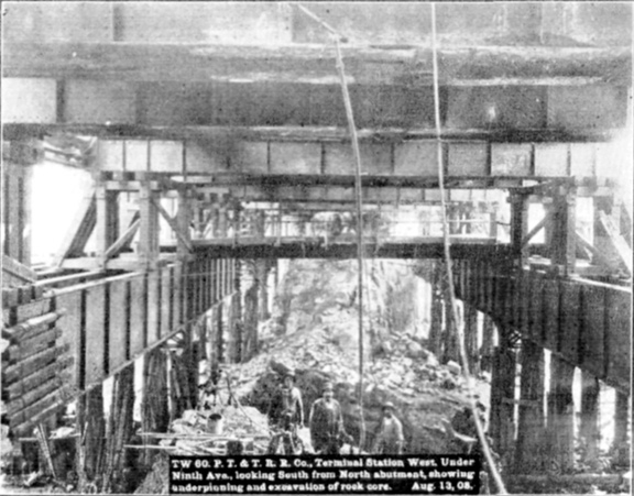 Plate XLIX, Fig. 1.&mdash; TW 60, P.T. & T.R.R. Co. Terminal Station West. Under Ninth Ave., looking South from North abutment, showing underpinning and excavation of rock core. Aug. 13, 08.