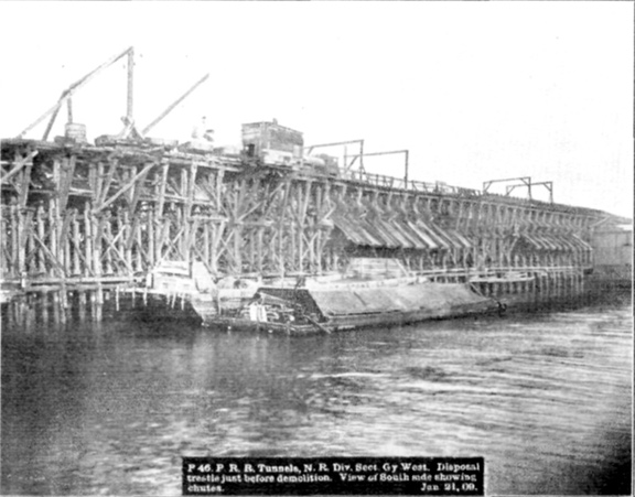 Plate LI, Fig. 3.&mdash; P 46. P.R.R. Tunnels, N.R. Div. Sect. Gy. West. Disposal trestle just before demolition. View of South side showing chutes. Jan. 21, 09.