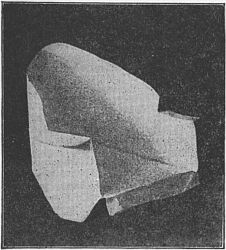 Fig. 94&mdash;Make the arm-chair of an
oblong envelope.