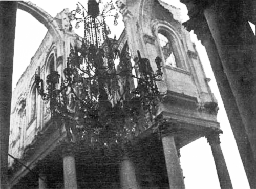 The stone roof over this glass chandelier in the Arras cathedral was
destroyed by shells, and the chandelier not touched.