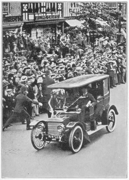 A SUFFRAGETTE THROWING A BAG OF FLOUR AT MR. ASQUITH IN
CHESTER