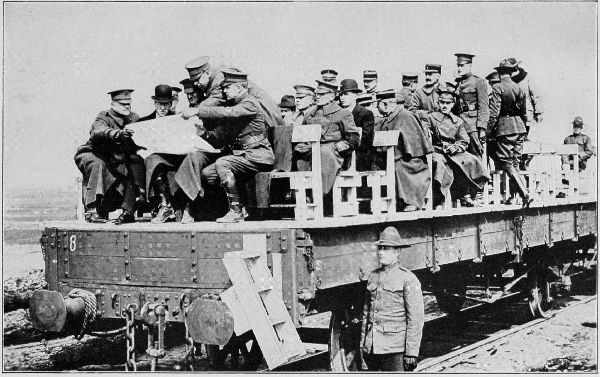 Copyright by the Committee on Public Information.

Secretary Baker riding on flat car during his tour of inspection of the
American Expeditionary Forces.