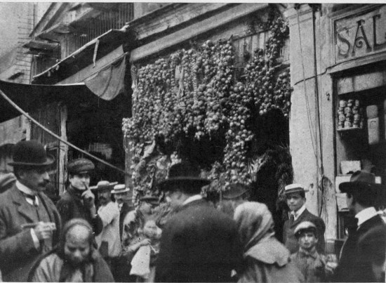 “The Holy Bambino ... barely discernible among the
rustling strings of onions over the door.”