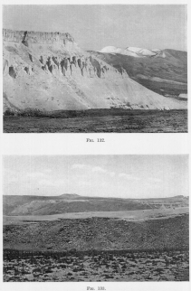 Fig. 132&mdash;Recessed volcanoes in the right background and
eroded tuffs, ash beds, and lava flows on the left. Maritime Cordillera
above Cotahuasi.