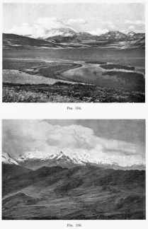 Fig. 134&mdash;Southwestern aspect of the Cordillera
Vilcapampa between Anta and Urubamba from Lake Huaipo. Rugged summit
topography in the background, graded post-mature slopes in the middle
distance, and solution lake in limestone in the foreground.