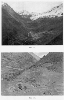 Fig. 137&mdash;Looking up a spurless flat-floored glacial
trough near the Chucuito pass in the Cordillera Vilcapampa from 14,200
feet (4,330 m.). Note the looped terminal and lateral moraines on the
steep valley wall on the left. A stone fence from wall to wall serves to
inclose the flock of the mountain shepherd.