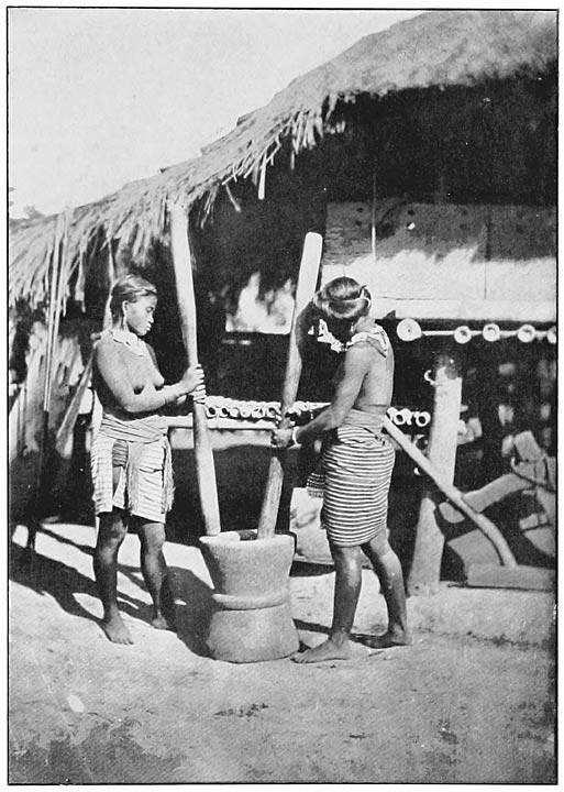 Native women pounding rice in the province of Cagay&aacute;n