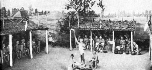 The &ldquo;husk&rdquo; or green corn ceremony, still practiced today, may be as old as the Indian&rsquo;s use of corn. Here the priest offers the new fire to the Master of Breath. Museum diorama.