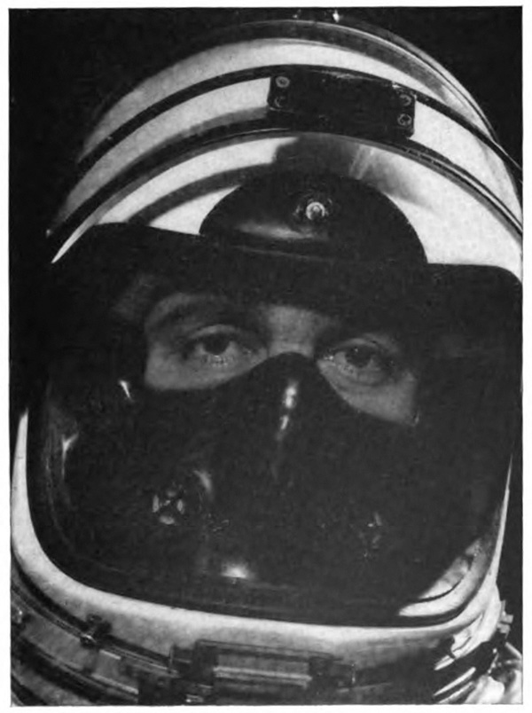 A person's head in an astronaut's helmet with only the eyes visible